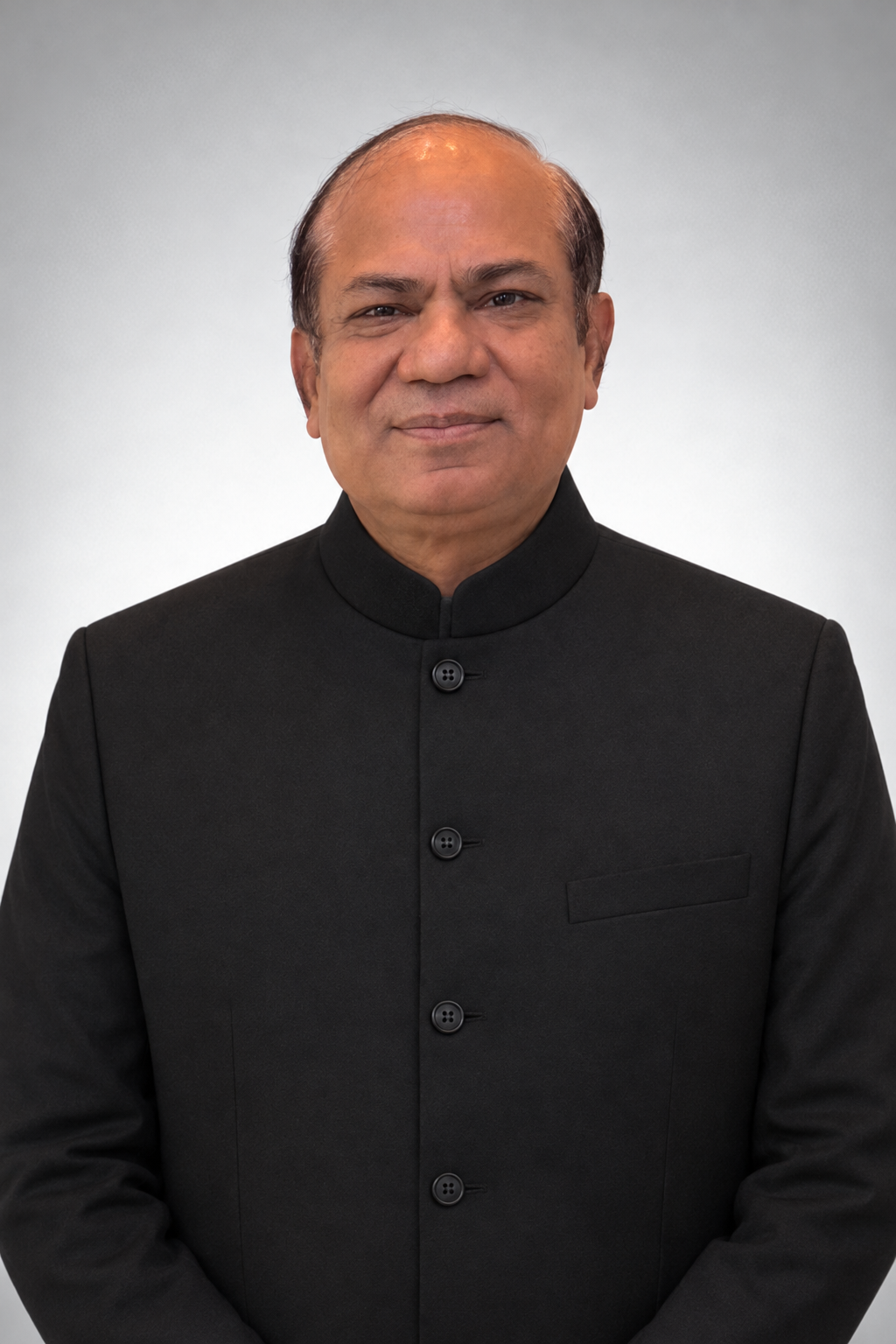 Sanjay Kumar Agarwal in a black bandhgala
